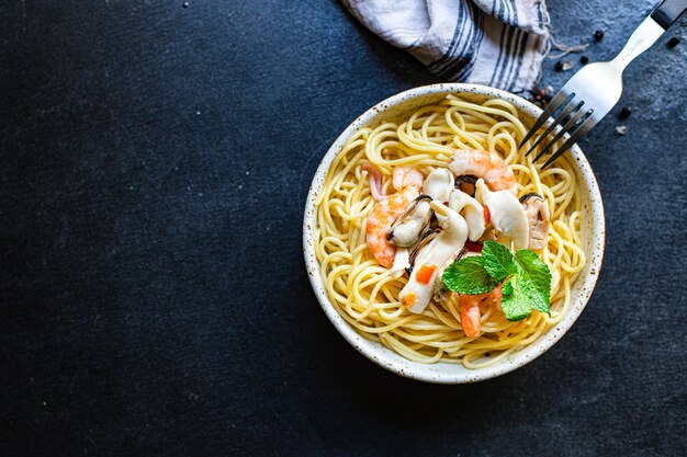 spaghetti seafood pasta shrimp, mussels, squid and more second course