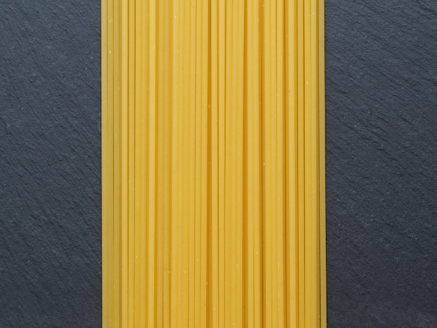 Spaghetti on a slate background.