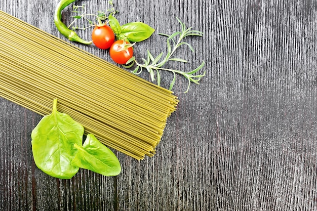 Spaghetti spinach on dark board top