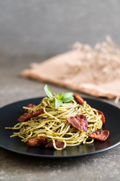 Spaghetti with basil pesto and bacon