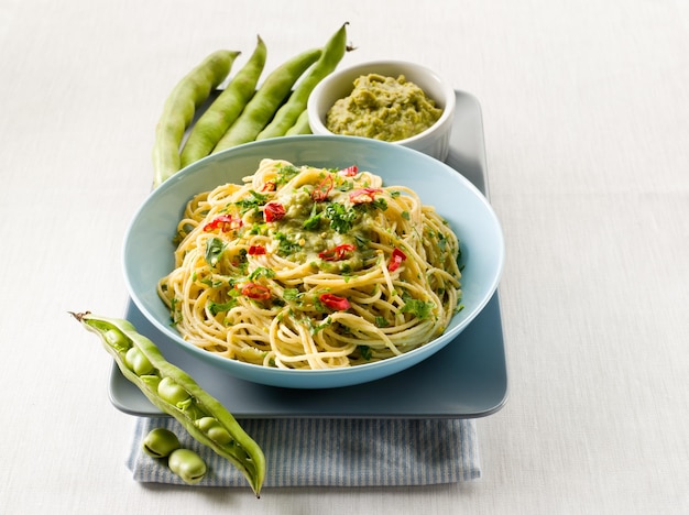 Spaghetti with bean broad sauce and hot chili pepper