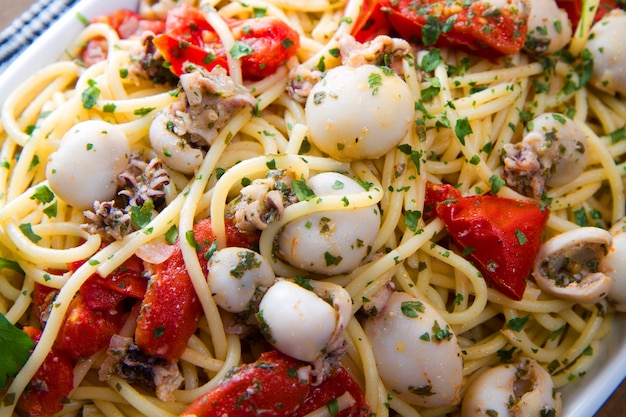 Spaghetti with cuttlefish and tomatoes