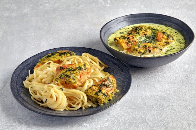 Spaghetti with fried chicken baked with garlic and herbs in milk