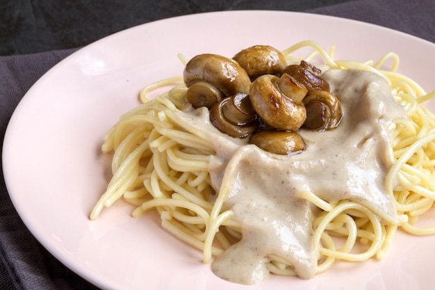 Spaghetti with mushrooms in cream sauce.