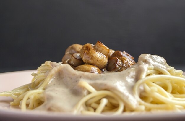 Spaghetti with mushrooms in cream sauce.