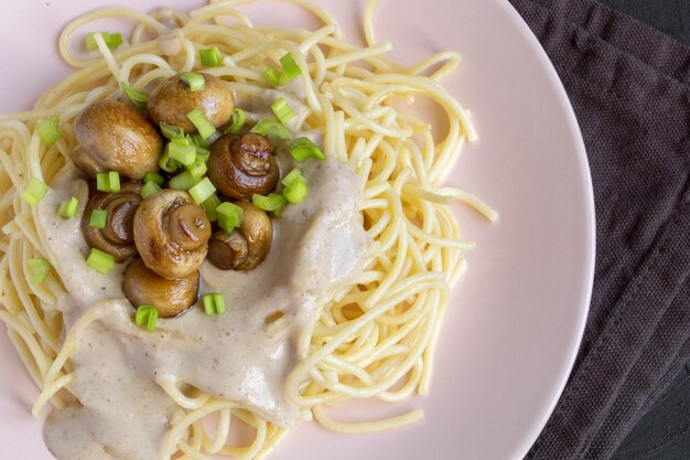 Spaghetti with mushrooms in cream sauce.