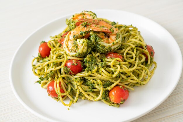 Spaghetti with prawns or shrimps in homemade pesto sauce - Healthy food style