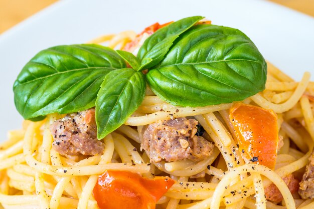 Spaghetti with sausage and cherry tomatoes