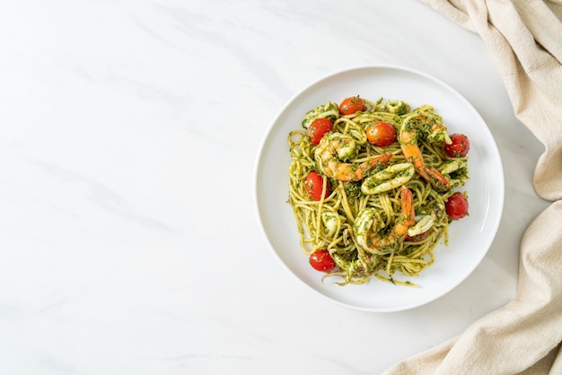 Spaghetti with seafood in homemade pesto sauce