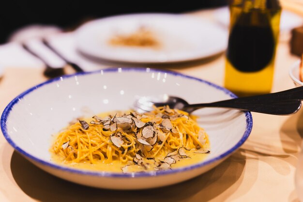 Spaghetti with truffle mushrooms creamy sauce on dinner table