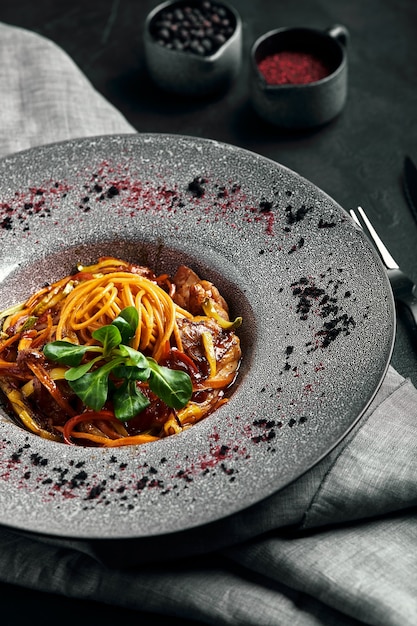 Spaghetti with vegetables on plate