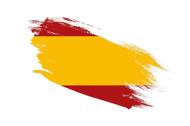 Foto bandiera della spagna con effetti dipinti a pennello su sfondo bianco isolato