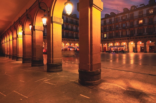 Spain SanSebastian June 5 2021 Selective focus on building and pavement Constitution Square and the former town hall at twilight The main square of the cultural capital of Europe