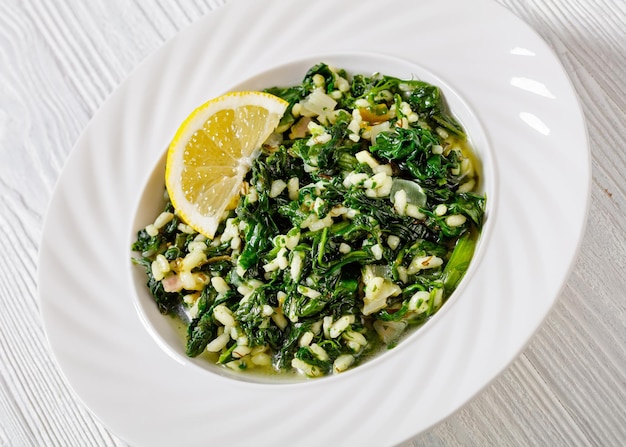 Spanakorizo Greek spinach and rice pilaf in bowl