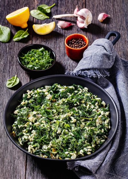 Spanakorizo Greek spinach and rice pilaf in pan