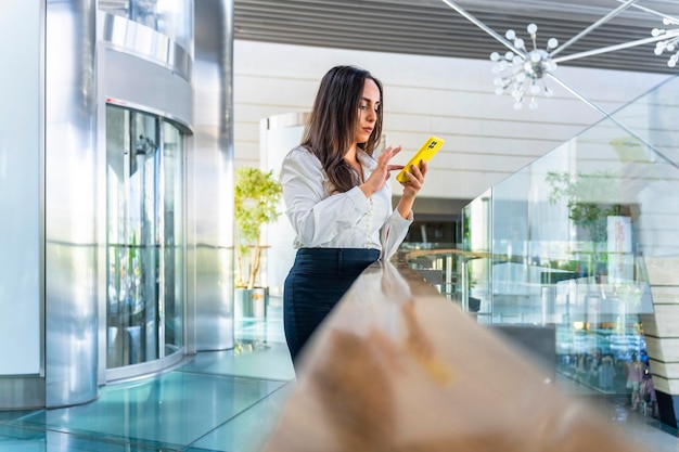 Spanish Businesswoman Serious businesswoman consulting a negative value on the phone