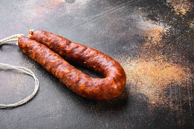 Spanish chorizo salami sausage on dark background.