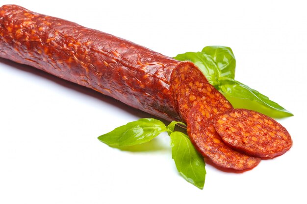 Spanish chorizo sausage on white surface