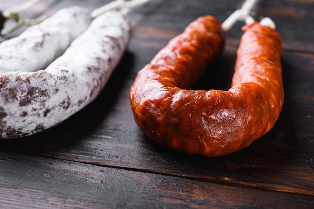 Spanish chorizo sausages on old wooden table.