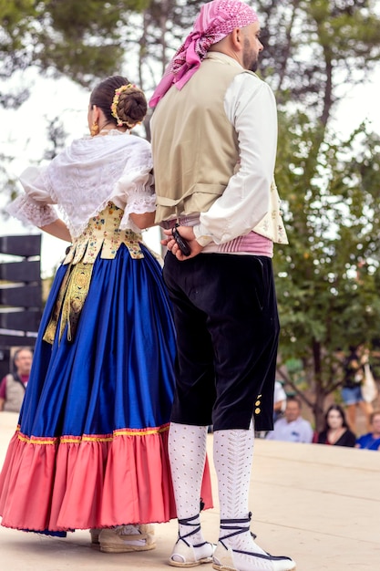 Spanish couple wearing traditional costumes in a folkloric dance