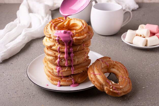 Spanish dessert churros with pink glaze