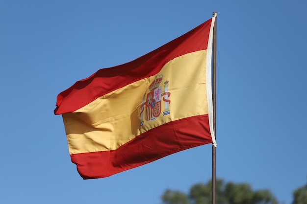 Spanish flag flying on flagpole