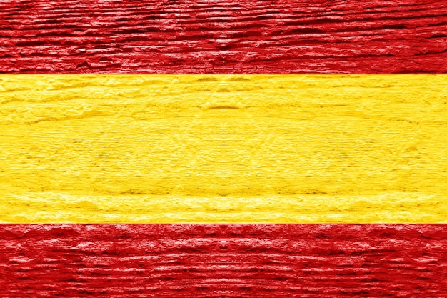 Photo spanish flag with wooden texture