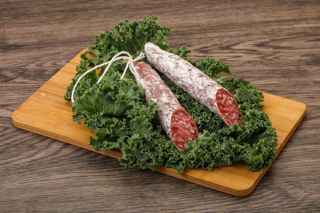 Spanish Fuet sausage with salad leaves