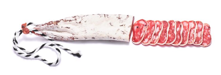 Spanish fuet thin dried salami sausage isolated on a white background