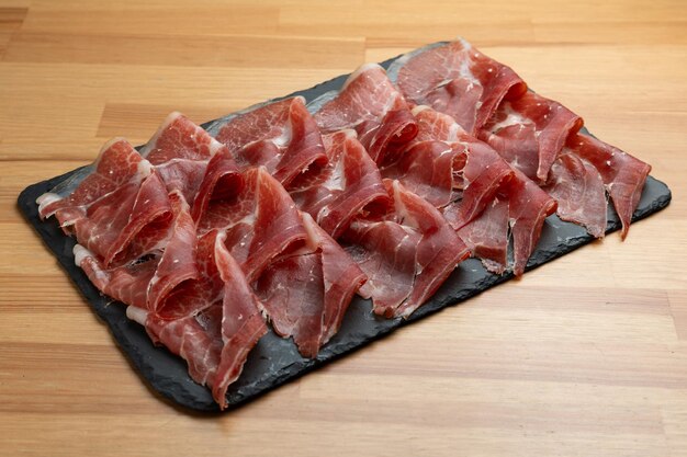 Photo spanish iberian ham tray