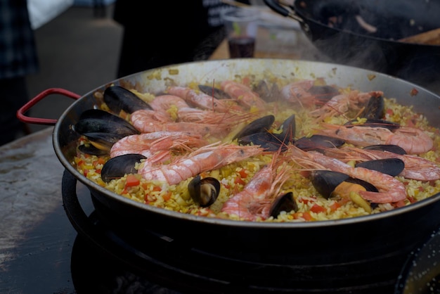 Spanish paella prepared in the street restaurant