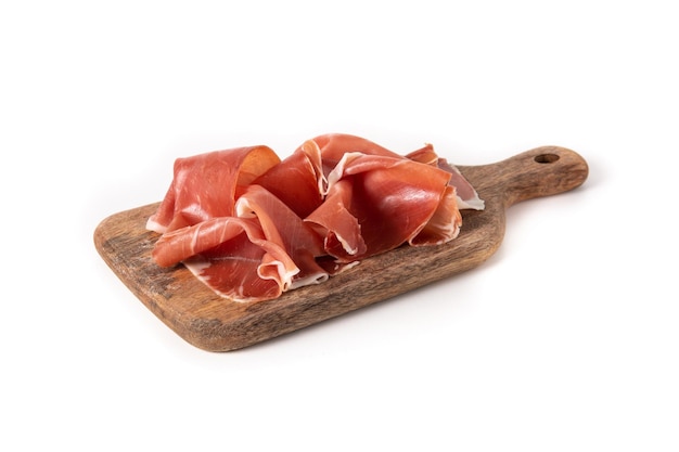Photo spanish serrano ham on cutting board isolated on white background