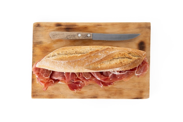 Spanish serrano ham sandwich isolated on white background