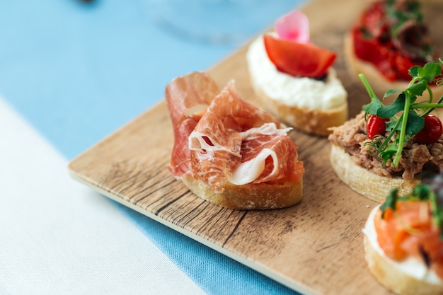 Spanish sliced pork meat on the wooden cutting board