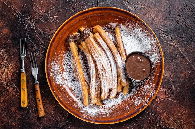 スペインのタパスチュロスと砂糖とチョコレートソース