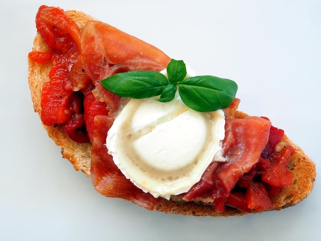 Spanish Tapas Roasted Red Pepper Bruschetta with Serrano Ham and Goat Cheese