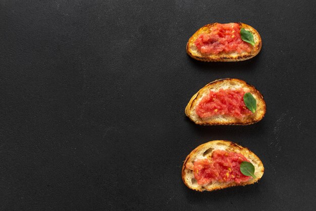 Spanish tomato toast traditional breakfast or lunch spanish\
toast on a dark background top view copy