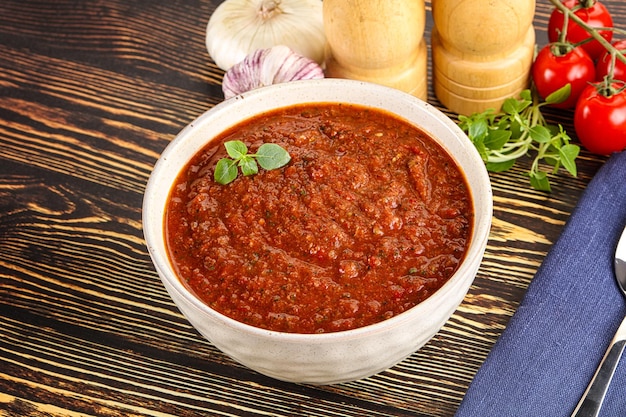 Spanish traditional gazpacho tomato soup served basil