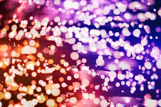 Sparkle background De-focused bokeh abstract Christmas copy space Shimmering blue spotlights defocused golden lights New Years disco party