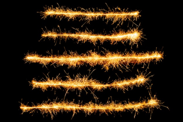 Photo sparkle fireworks lines isolated on black background.