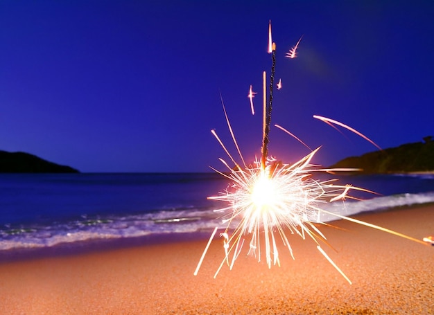 Sparklers at the beach at christmas happy christmas