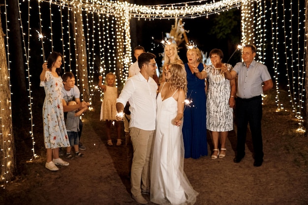 Sparklers at the wedding of the newlyweds