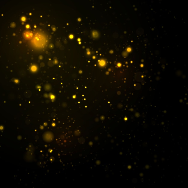 Sparkling dust particles on a black background