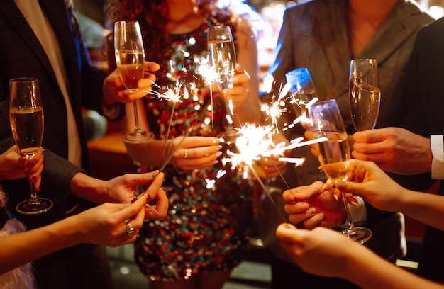 Sparkling sparklers in the hands Playing firework to celebrate winter holidays Magic New Year