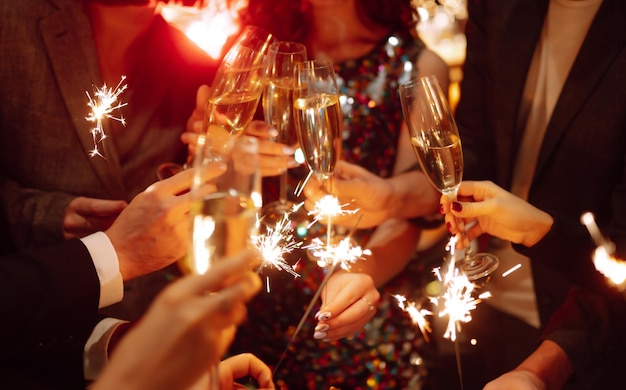 Sparkling sparklers in the hands Playing firework to celebrate winter holidays Magic New Year