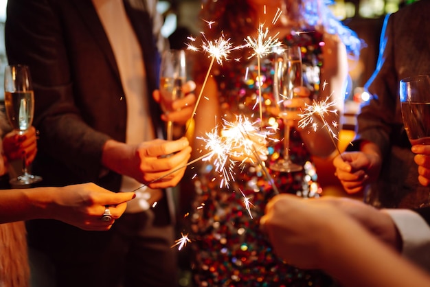 Sparkling sparklers in the hands Playing firework to celebrate winter holidays Magic New Year