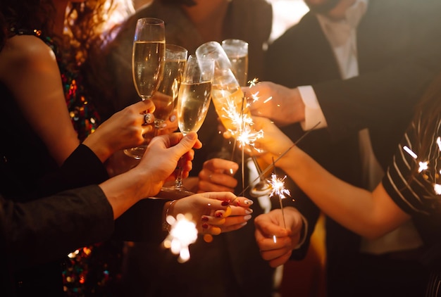 Sparkling sparklers in the hands Playing firework to celebrate winter holidays Magic New Year