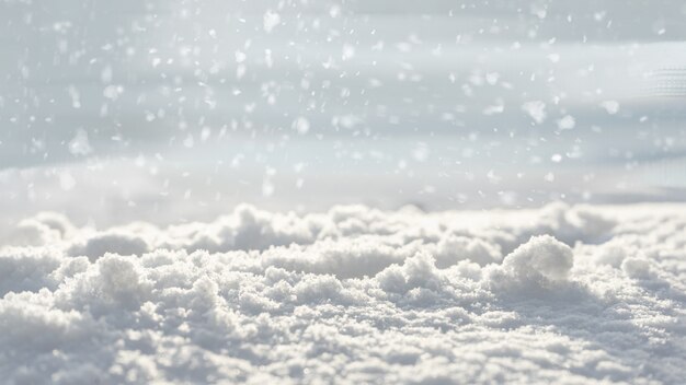 Photo sparkling white snow with a soft blurry background and snowflakes. copy space. the concept of a light festive christmas mood.