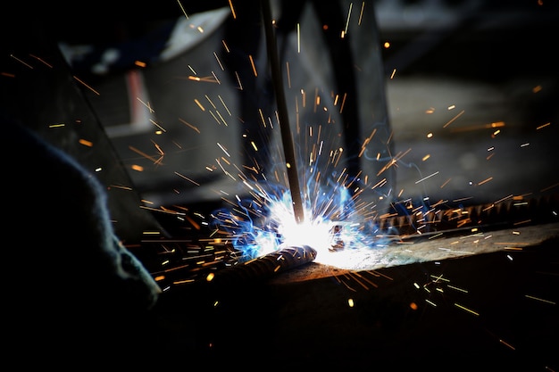 Sparks from welding on a dark background