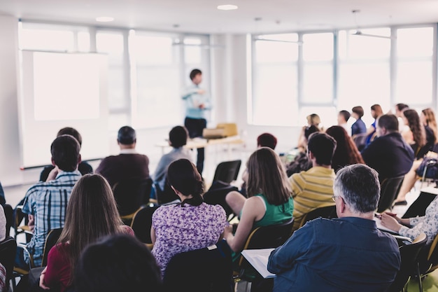 Speaker giving presentation on business conference